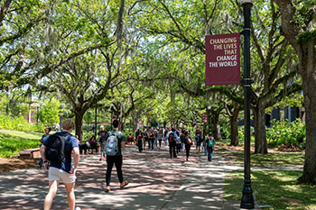 Photo of students walking outside. Links to Life Stage Gift Planner™