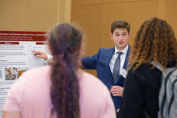 Photo of a student giving a presentation. Links to Closely Held Business Stock